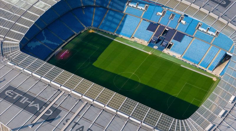 an aerial view of a soccer field in a stadium — Photo by Mylo Kaye on Unsplash